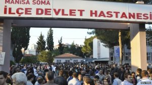 Crowds gather outside Soma's local hospital
