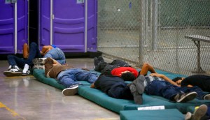 NOGALES, AZ - JUNE 18:  Young boys sleep in a holding cell where hundreds of mostly Central American immigrant children are being processed and held at the U.S. Customs and Border Protection Nogales Placement Center on June 18, 2014, in Nogales, Arizona.  Brownsville, Texas, and Nogales, have been central to processing the more than 47,000 unaccompanied children who have entered the country illegally since Oct. 1. (Photo by Ross D. Franklin-Pool/Getty Images)